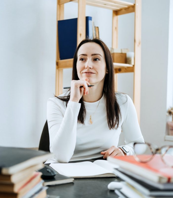 account-balance-definition-female-accountant-working-with-many-books-and-notepads.jpg
